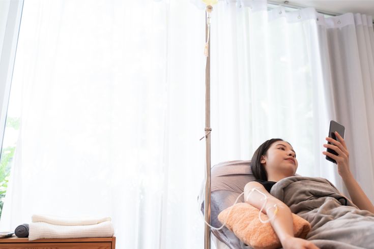 a woman looking relaxed while receiving iv drip therapy in liverpool
